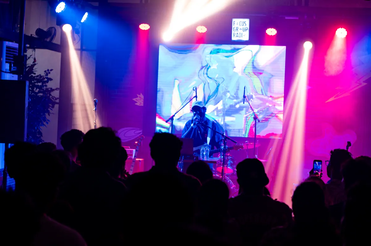 A musician performs before Television Dust visuals at The Angular Festival.