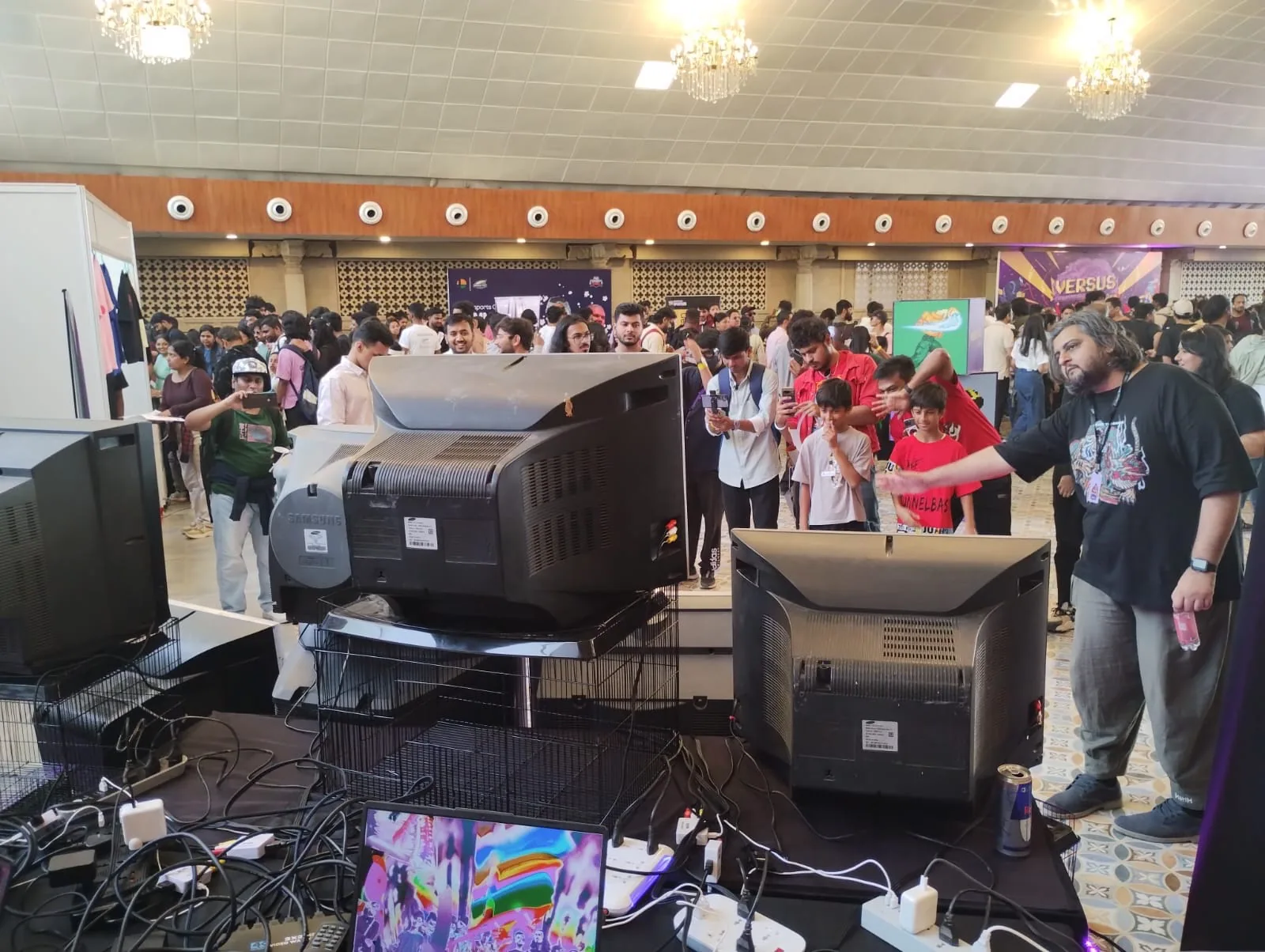 Visitors crowding around the CRT stack at Versus Festival.