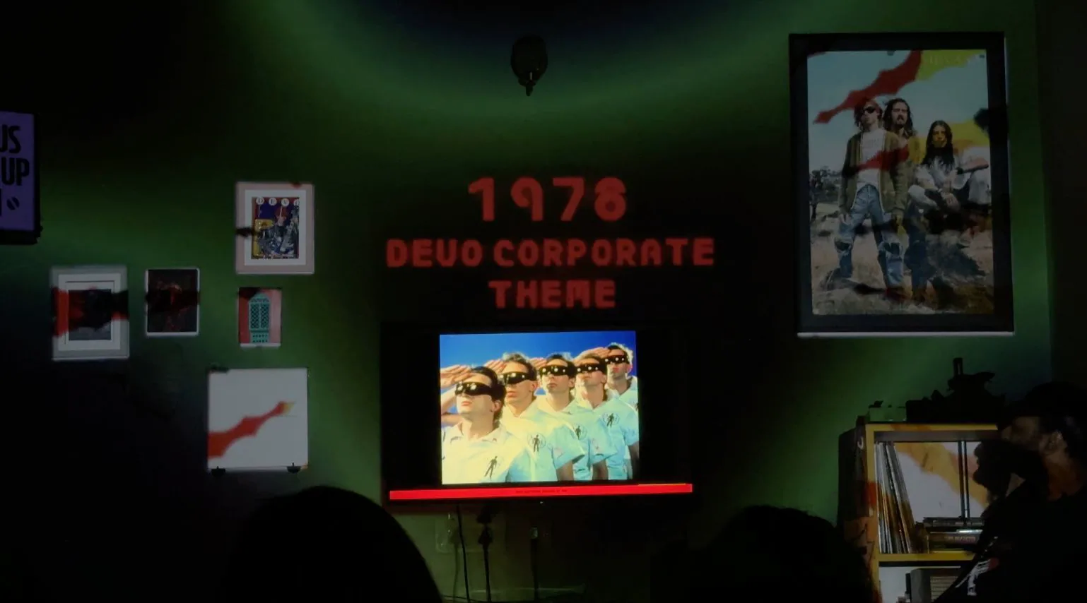 Corporate Theme visuals surrounding the listening session.