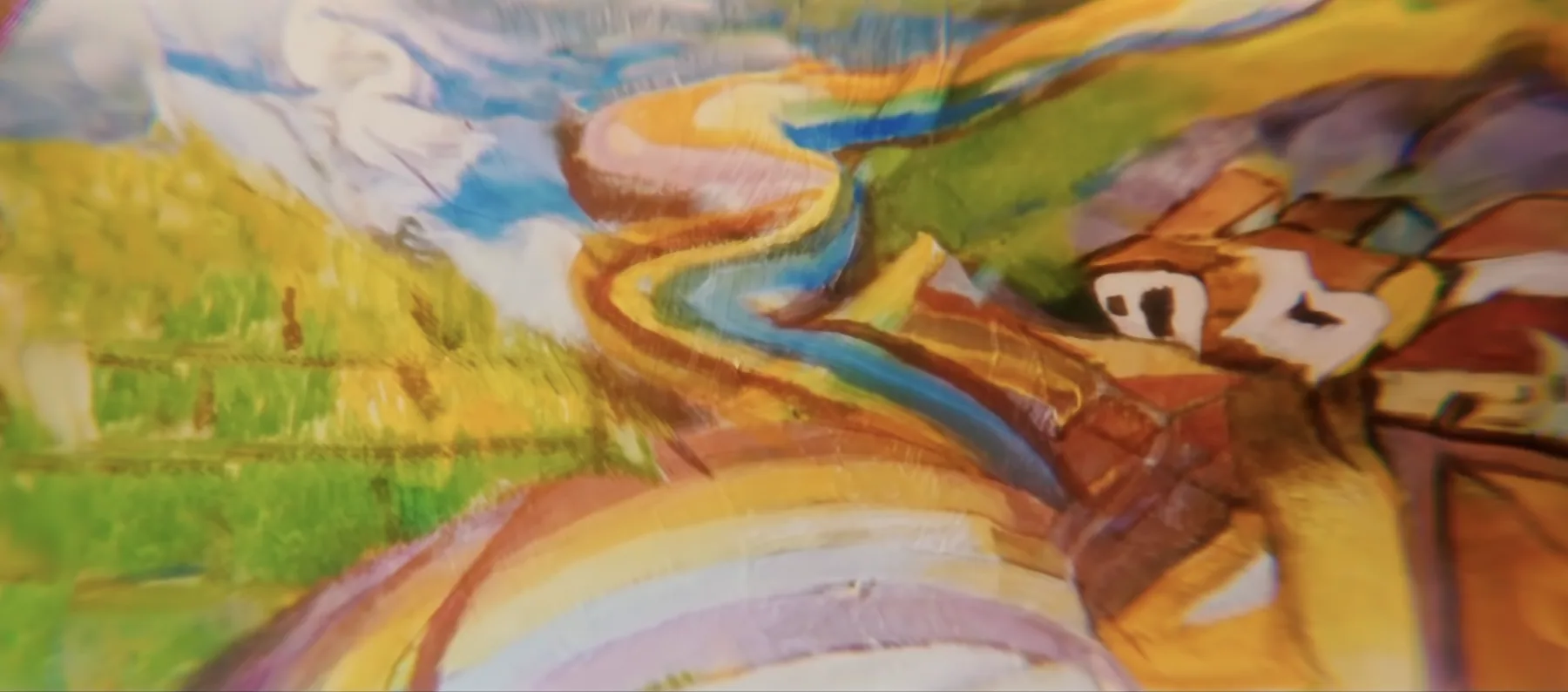 A painted landscape smeared across a curved surface.
